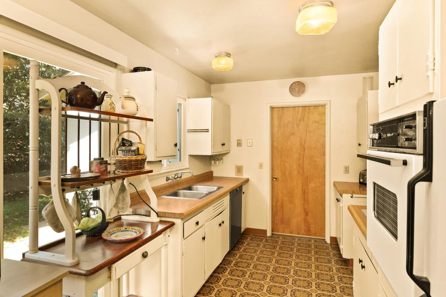 3230 Rio Road Carmel, CA 93923 - Photo 8 of 21 a kitchen with stainless steel appliances a sink a stove and a refrigerator