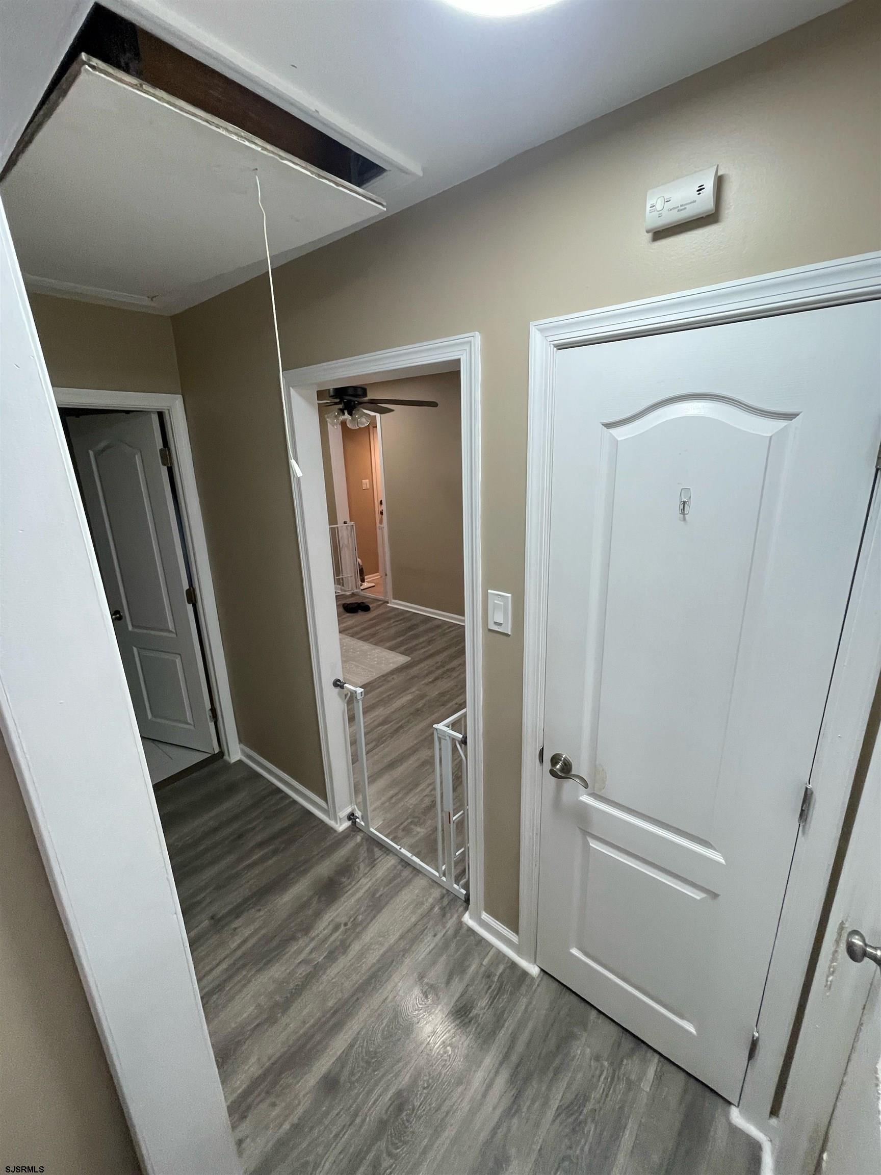 241 Warren Avenue Bellmawr, NJ 08031 - Photo 13 of 26 wooden floor in an empty room