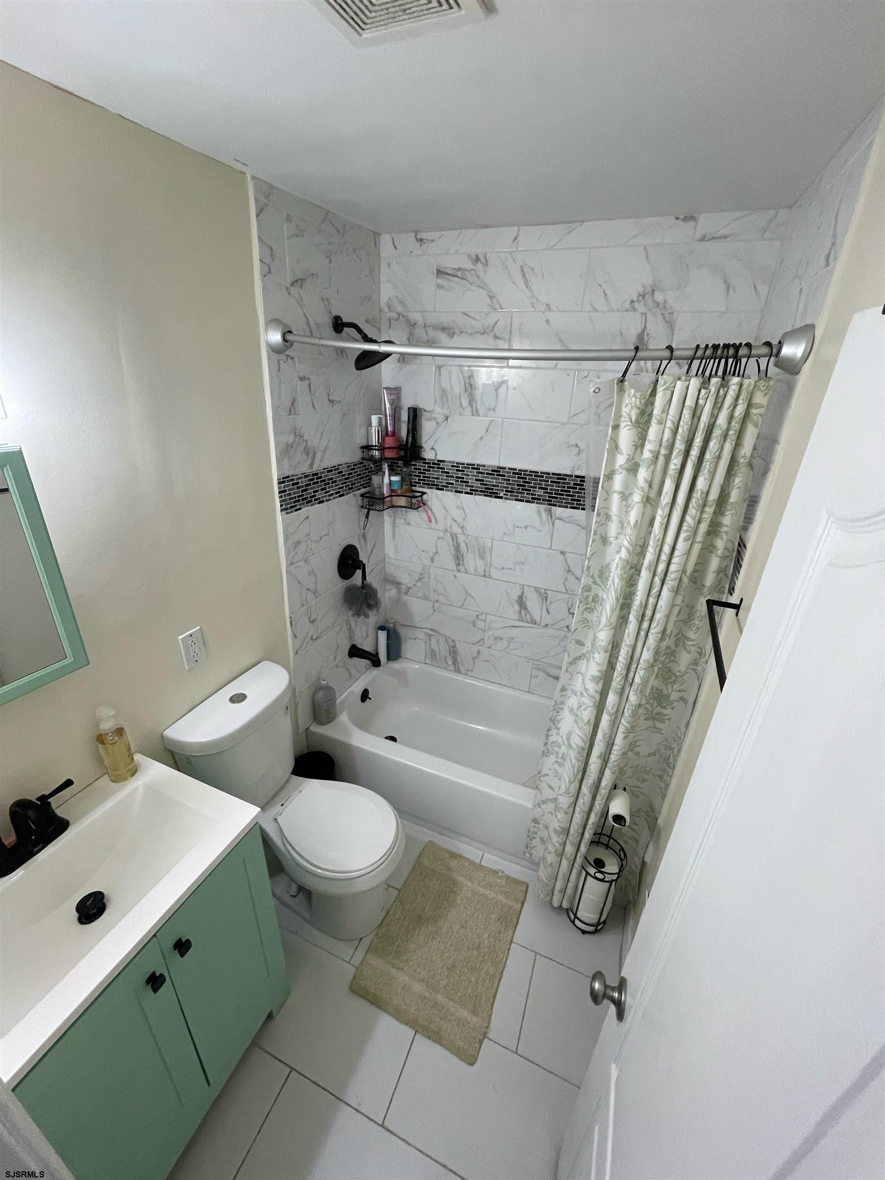 241 Warren Avenue Bellmawr, NJ 08031 - Photo 14 of 26 a bathroom with a sink a toilet and shower