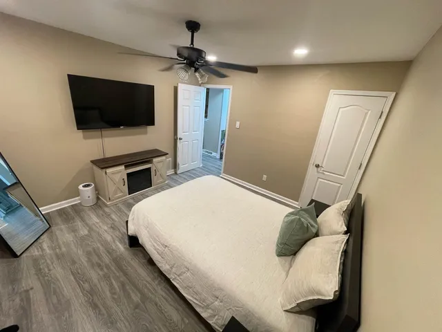 a view of walk in closet with clothes