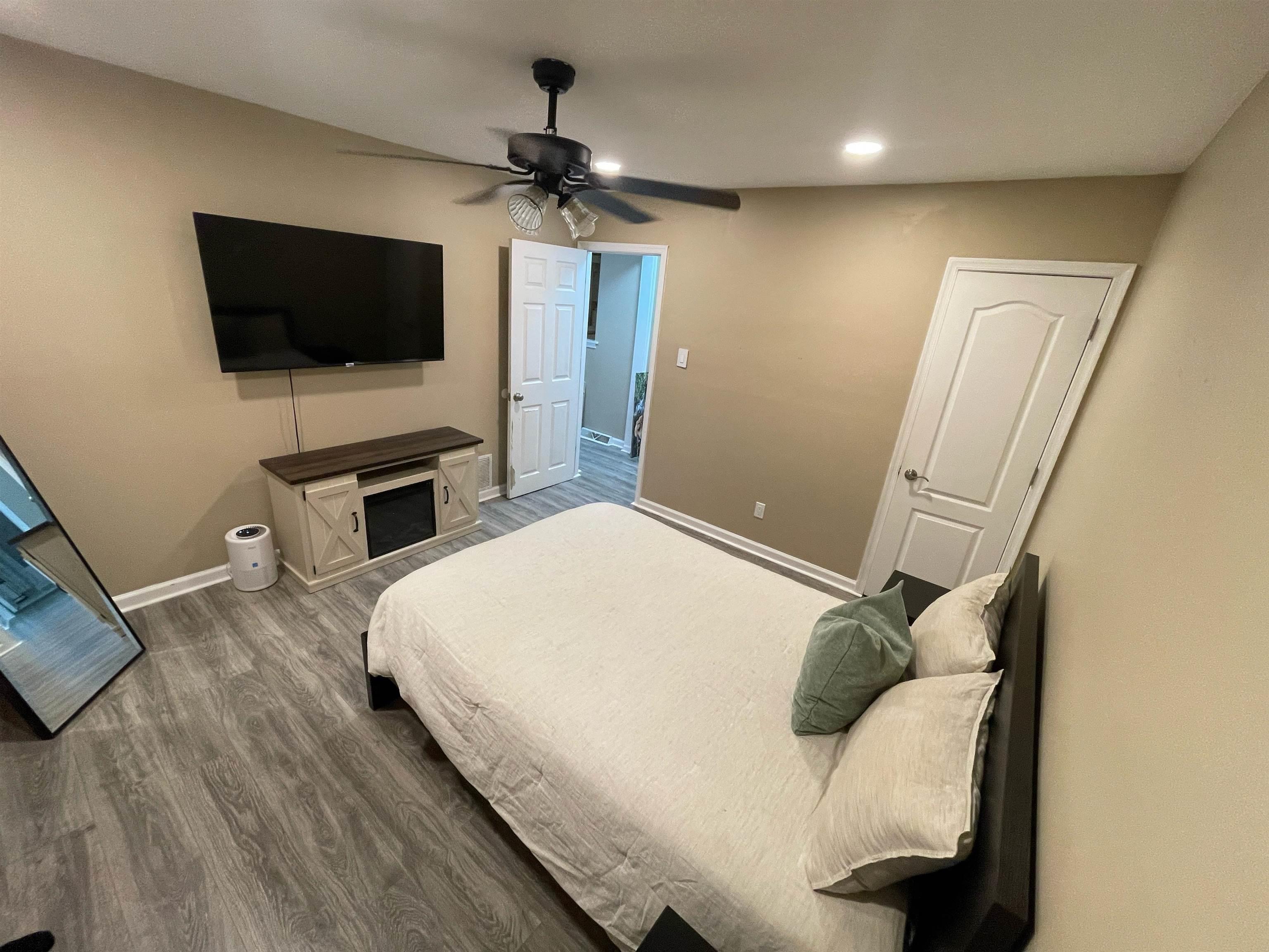 241 Warren Avenue Bellmawr, NJ 08031 - Photo 16 of 26 a bedroom with a bed and a flat screen tv