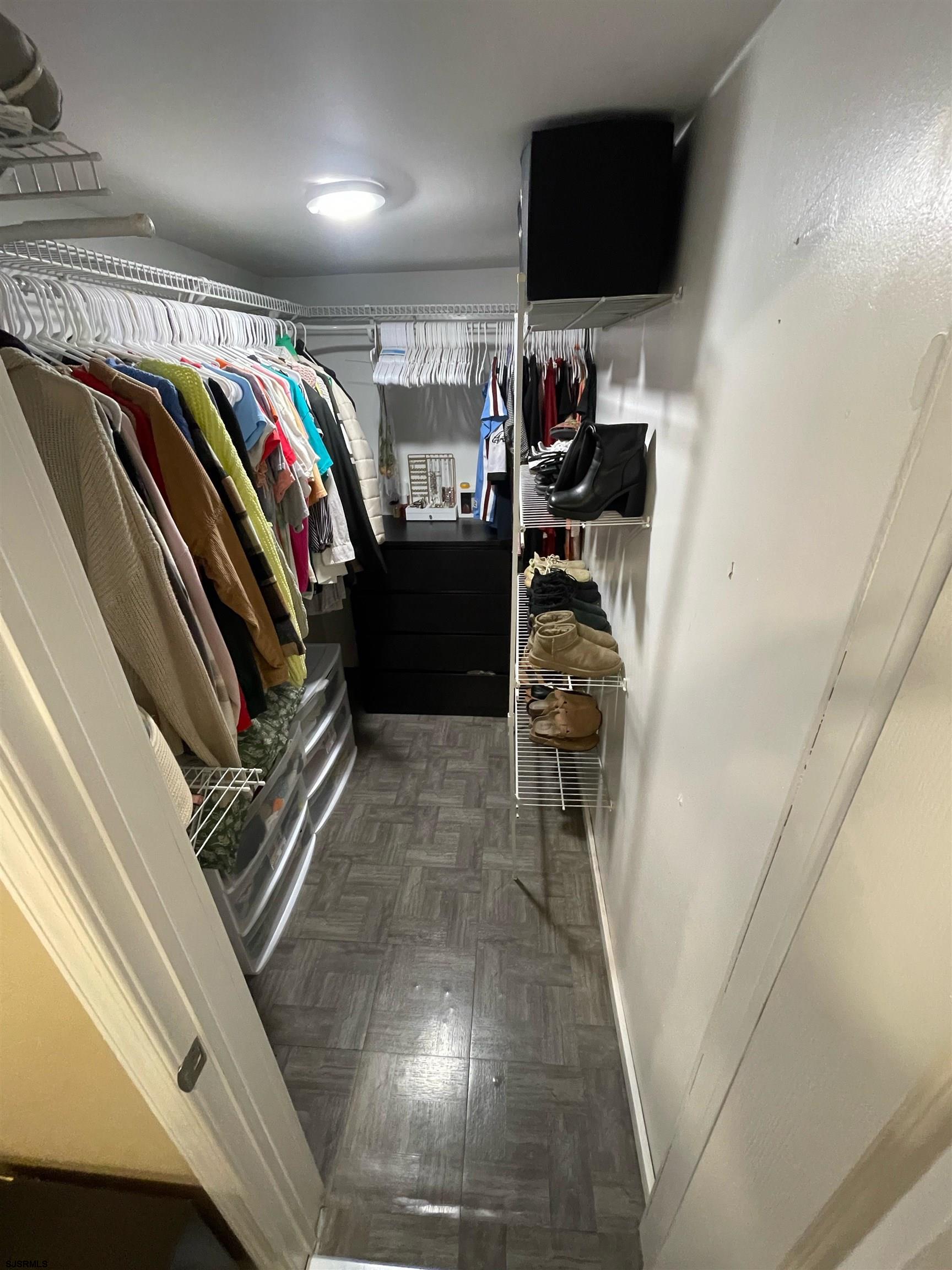 241 Warren Avenue Bellmawr, NJ 08031 - Photo 17 of 26 a view of walk in closet with clothes