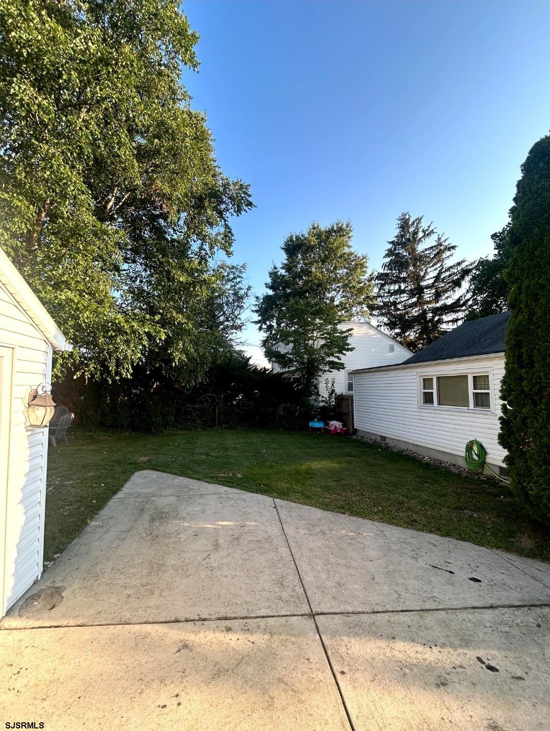 241 Warren Avenue Bellmawr, NJ 08031 - Photo 4 of 26 a view of a backyard of the house