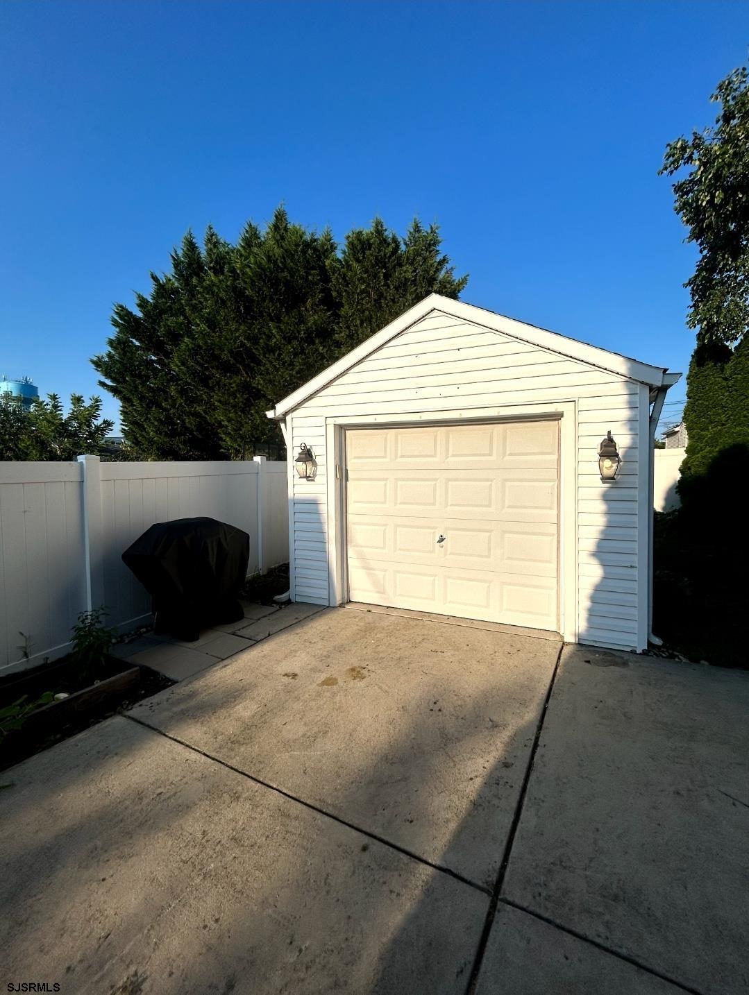 241 Warren Avenue Bellmawr, NJ 08031 - Photo 6 of 26 a view of backyard and garage