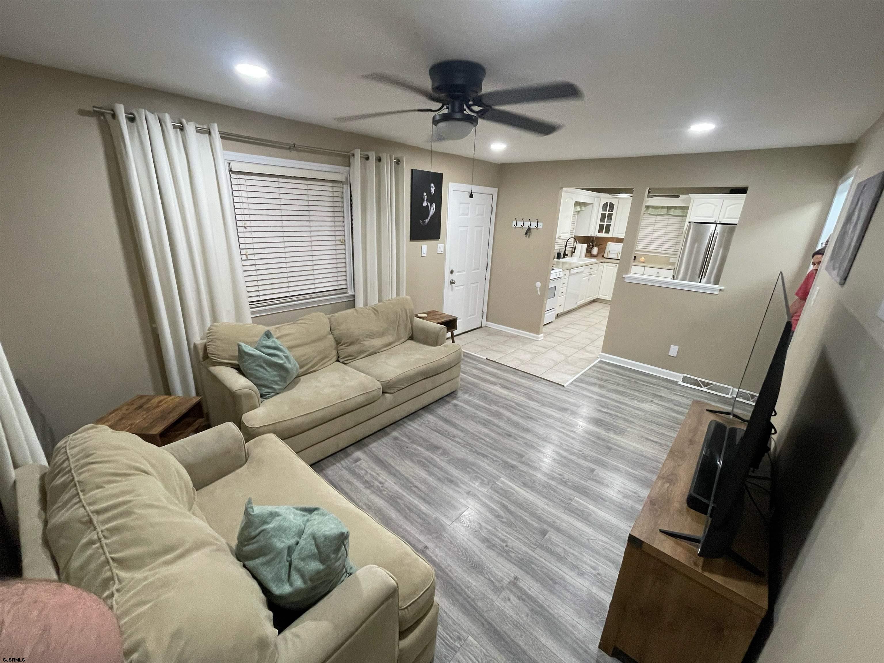 241 Warren Avenue Bellmawr, NJ 08031 - Photo 8 of 26 a living room with furniture and a wooden floor