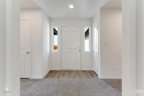 a view of a livingroom with an empty space and a window
