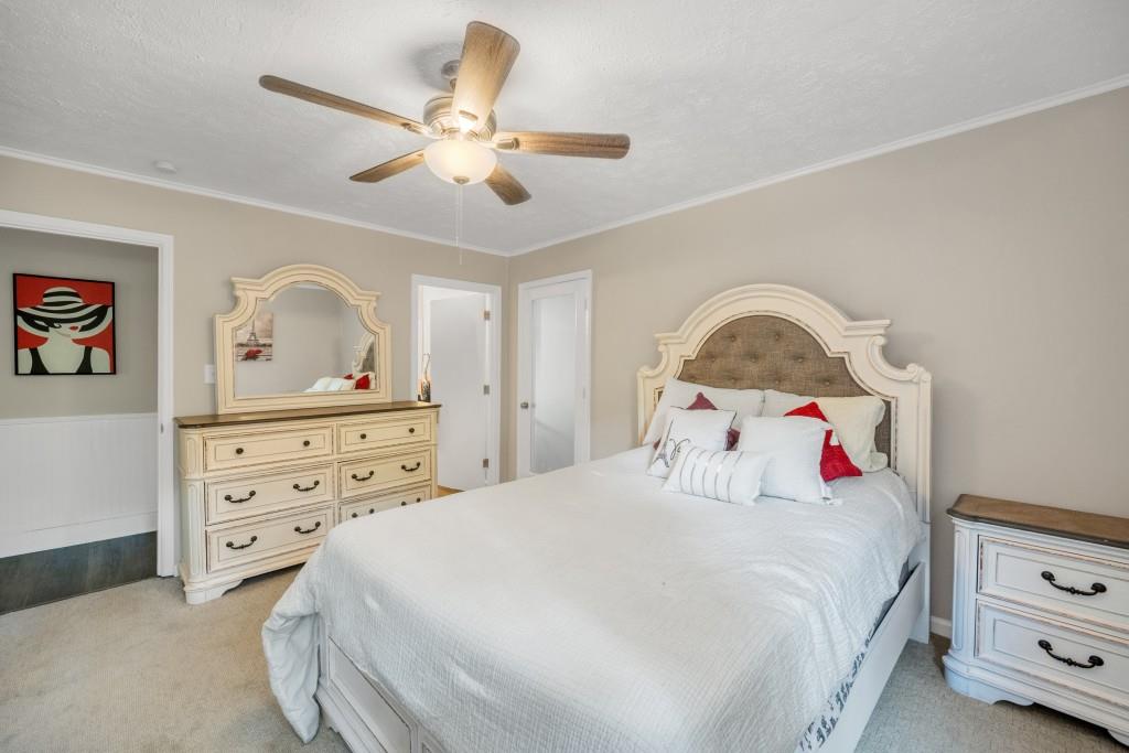 83 Summit Ridge Circle Southeast Cartersville, GA 30120 - Photo 11 of 32 a bedroom with a bed and a dresser