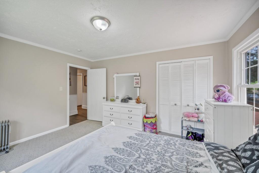 83 Summit Ridge Circle Southeast Cartersville, GA 30120 - Photo 17 of 32 a bed room with a bed and a window