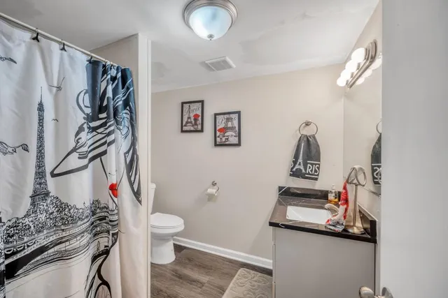 a bathroom with a shower and a sink