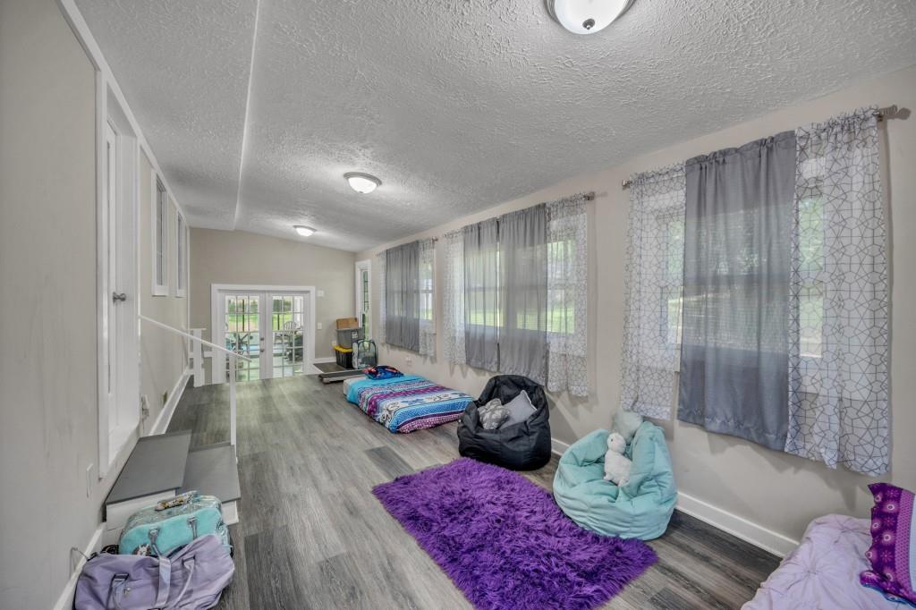 83 Summit Ridge Circle Southeast Cartersville, GA 30120 - Photo 24 of 32 a living room with furniture and a large window