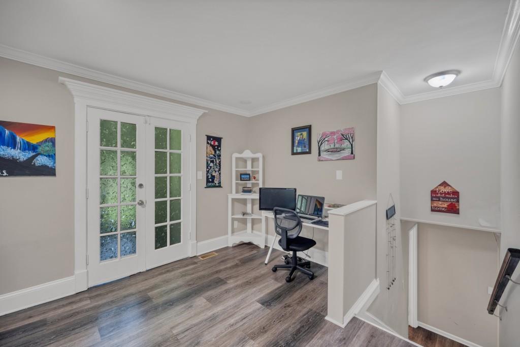 83 Summit Ridge Circle Southeast Cartersville, GA 30120 - Photo 5 of 32 a view of a workspace with furniture and a window