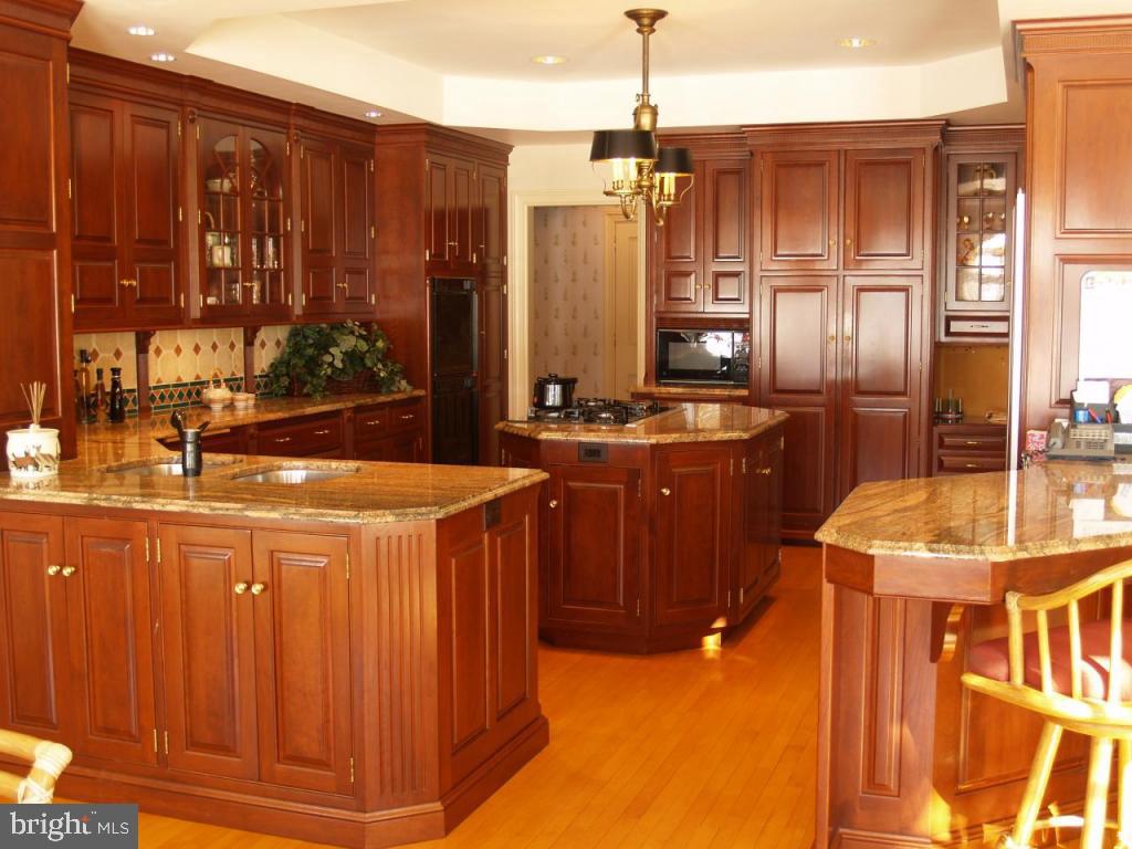 38 Oakhill Drive Lititz, PA 17543 - Photo 11 of 37 a kitchen with stainless steel appliances a sink stove and refrigerator
