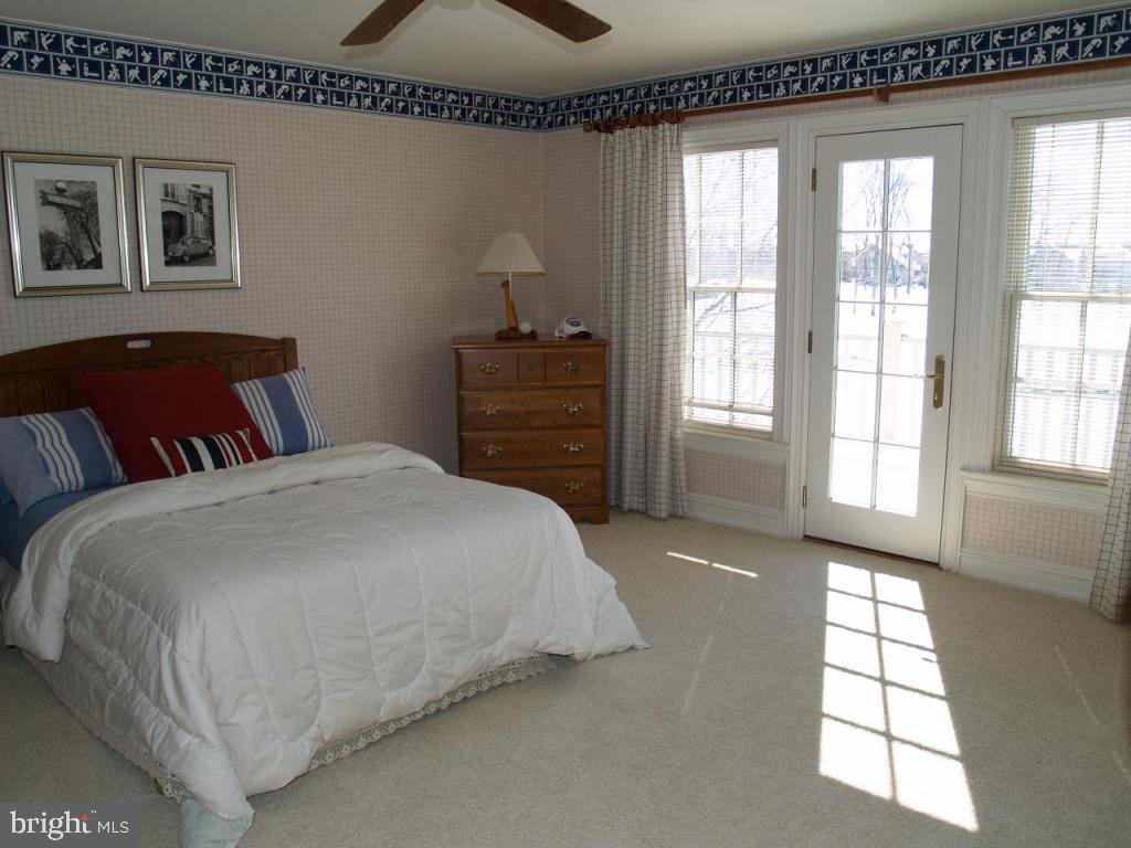 38 Oakhill Drive Lititz, PA 17543 - Photo 29 of 37 a spacious bedroom with a bed and wooden floor