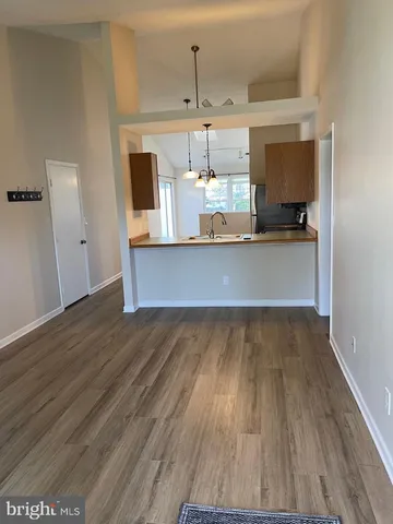 a view of kitchen with wooden floor