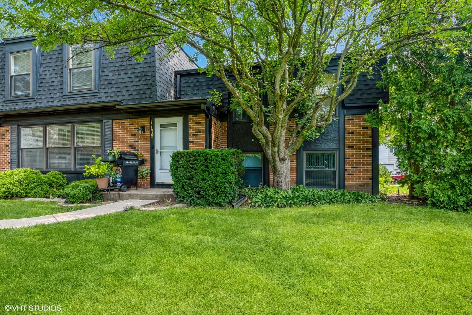 1138 Inverrary Lane Deerfield, IL 60015 - Photo 12 of 12 a view of a house with a yard and plants