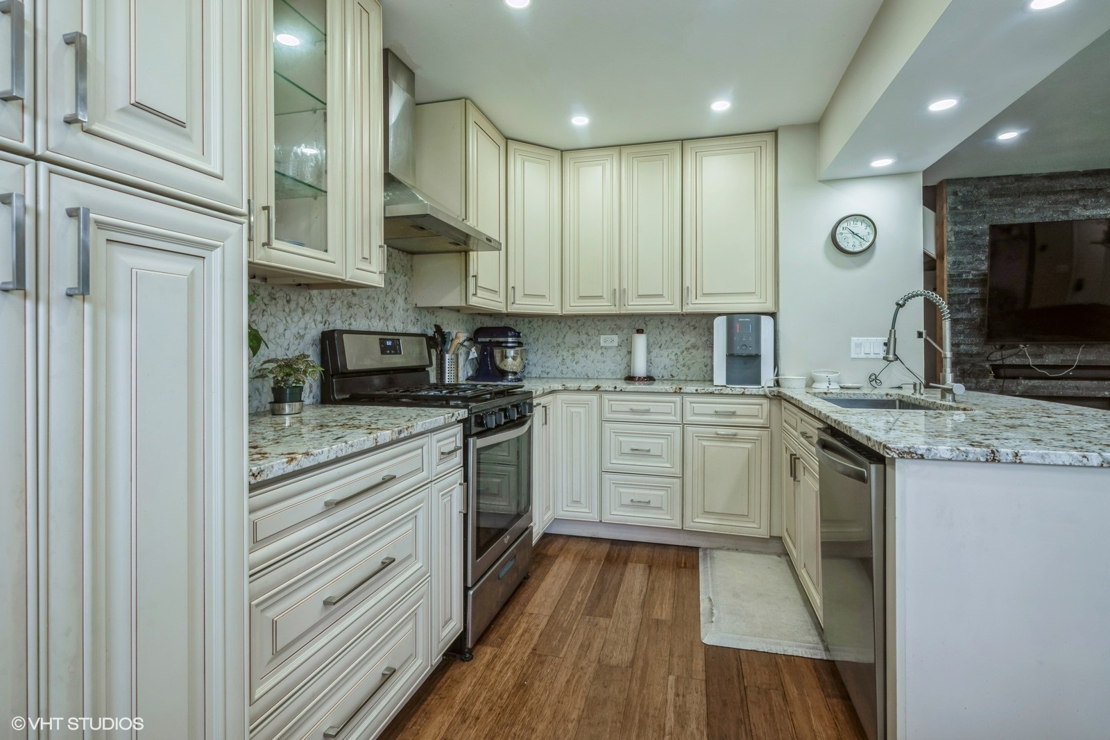 1138 Inverrary Lane Deerfield, IL 60015 - Photo 5 of 12 a kitchen with granite countertop stainless steel appliances and white cabinets