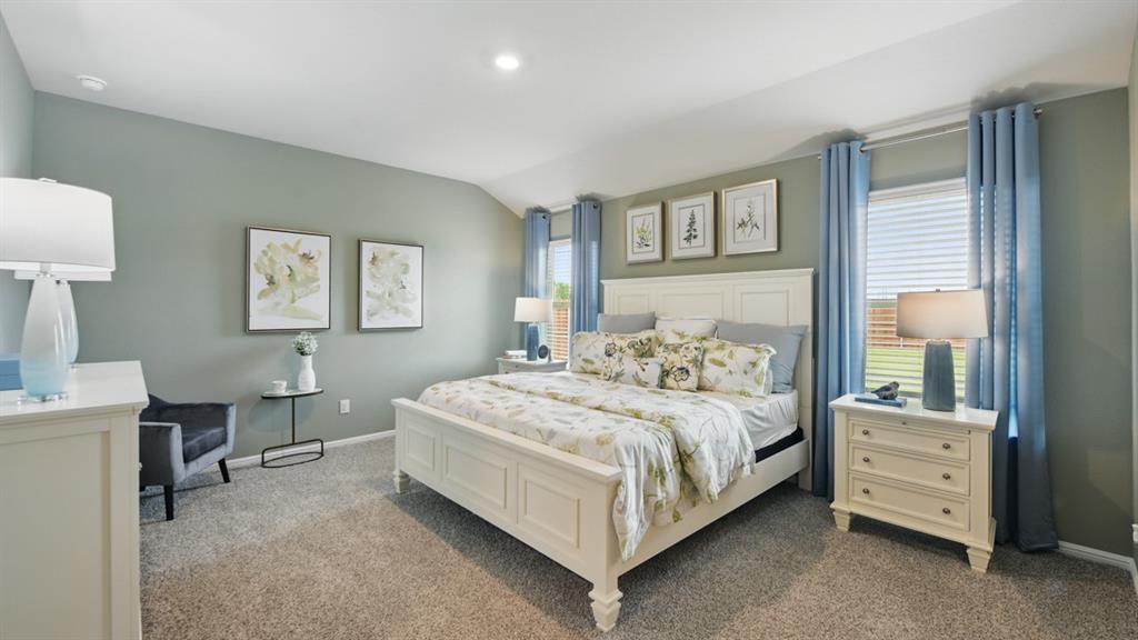 5545 Legends Way Krum, TX 76249 - Photo 13 of 36 a bedroom with a bed and a table in it