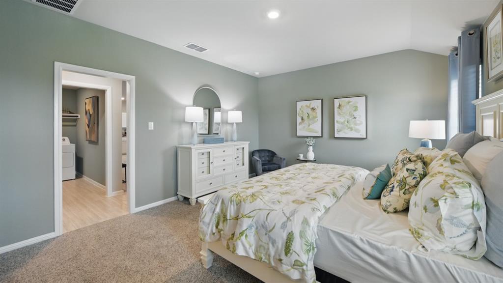 5545 Legends Way Krum, TX 76249 - Photo 14 of 36 a bedroom with a bed and a lamp