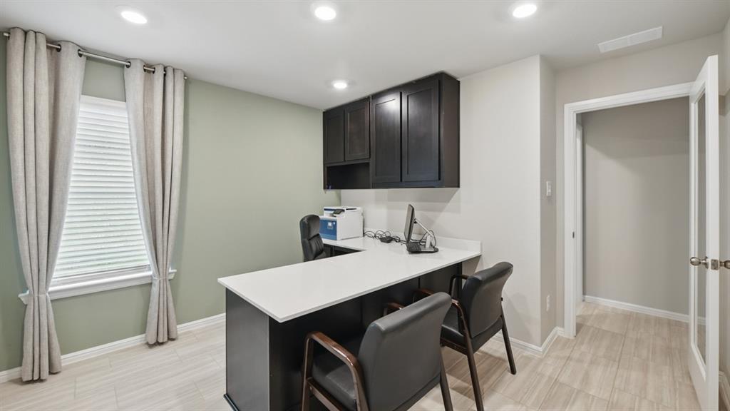 5545 Legends Way Krum, TX 76249 - Photo 27 of 36 a view of kitchen with granite countertop window and wooden floor