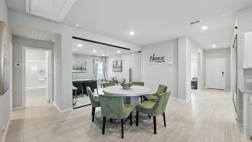 5545 Legends Way Krum, TX 76249 - Photo 7 of 36 a dining room with furniture and window