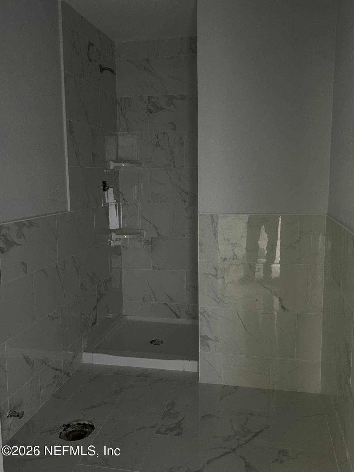 9959 Lem Turner Road Jacksonville, FL 32208 - Photo 10 of 22 a bathroom with a shower