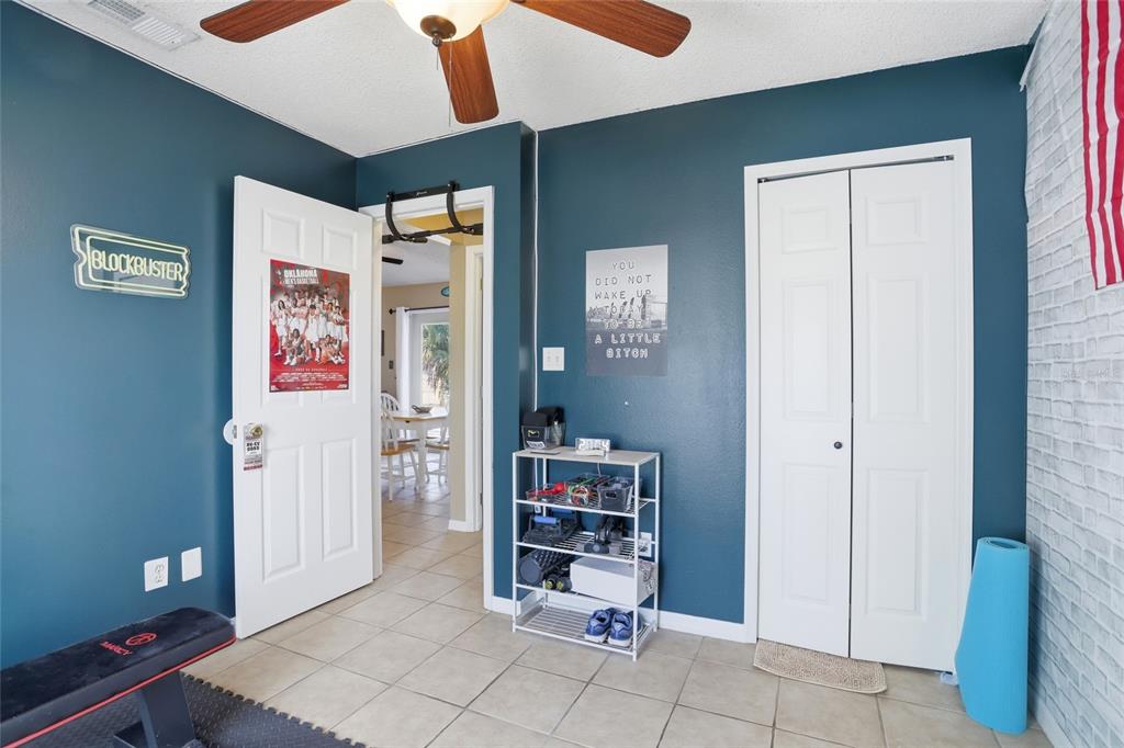 10735 Lake Ralph Drive Clermont, FL 34711 - Photo 20 of 37 a living room with furniture and baby crib