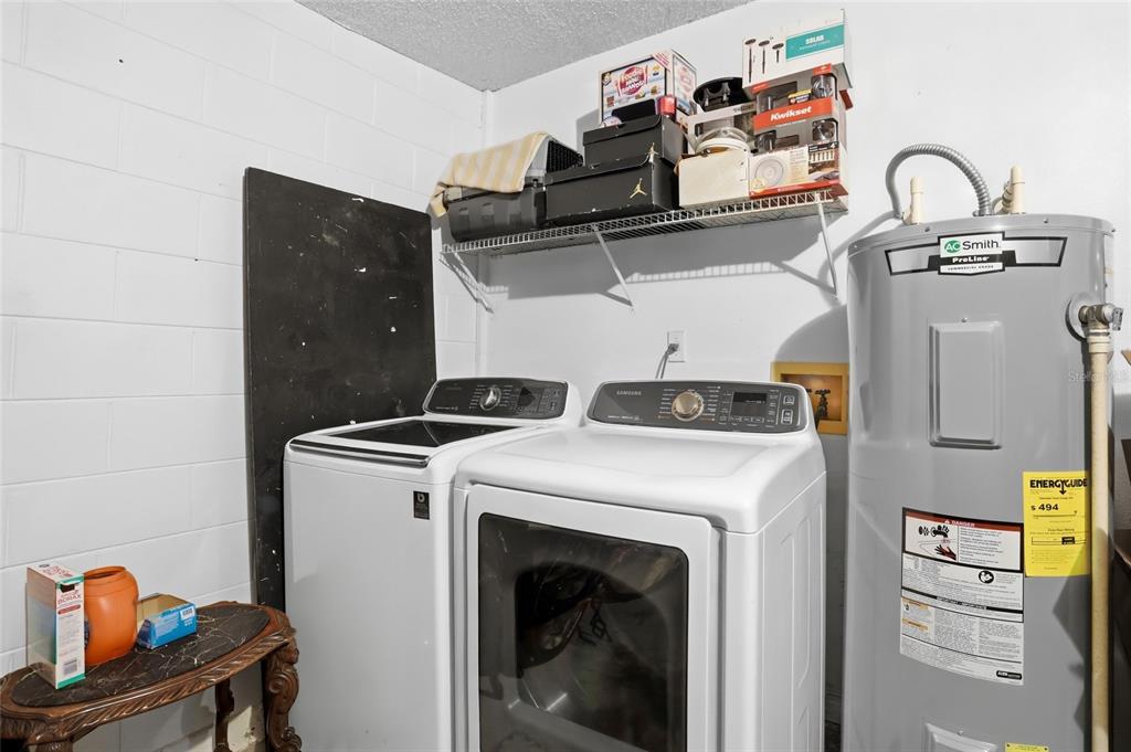 10735 Lake Ralph Drive Clermont, FL 34711 - Photo 25 of 37 a utility room with dryer and washer