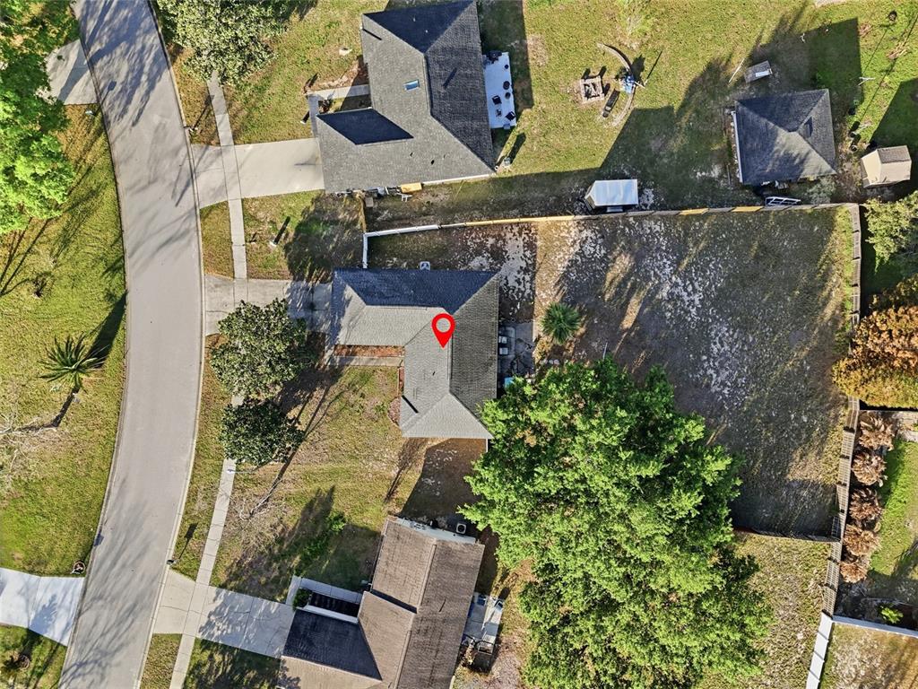 10735 Lake Ralph Drive Clermont, FL 34711 - Photo 3 of 37 an aerial view of residential houses with outdoor space