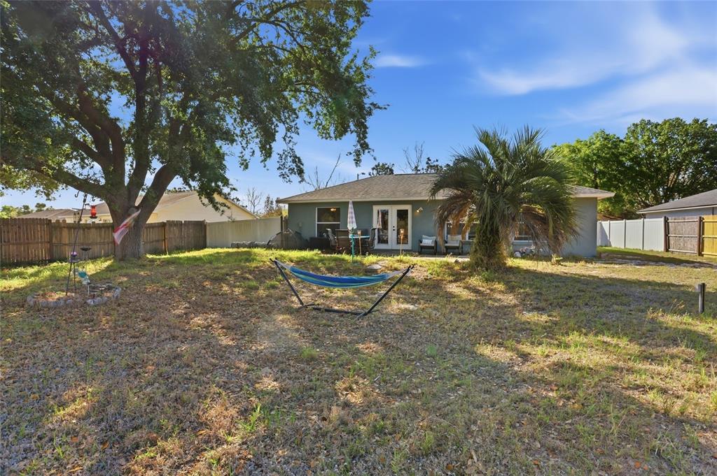 10735 Lake Ralph Drive Clermont, FL 34711 - Photo 31 of 37 a view of a house with a yard and sitting area