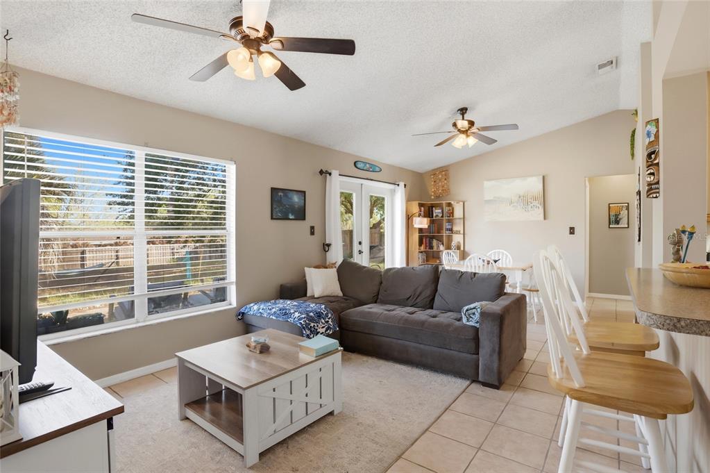 10735 Lake Ralph Drive Clermont, FL 34711 - Photo 5 of 37 a living room with furniture and a window
