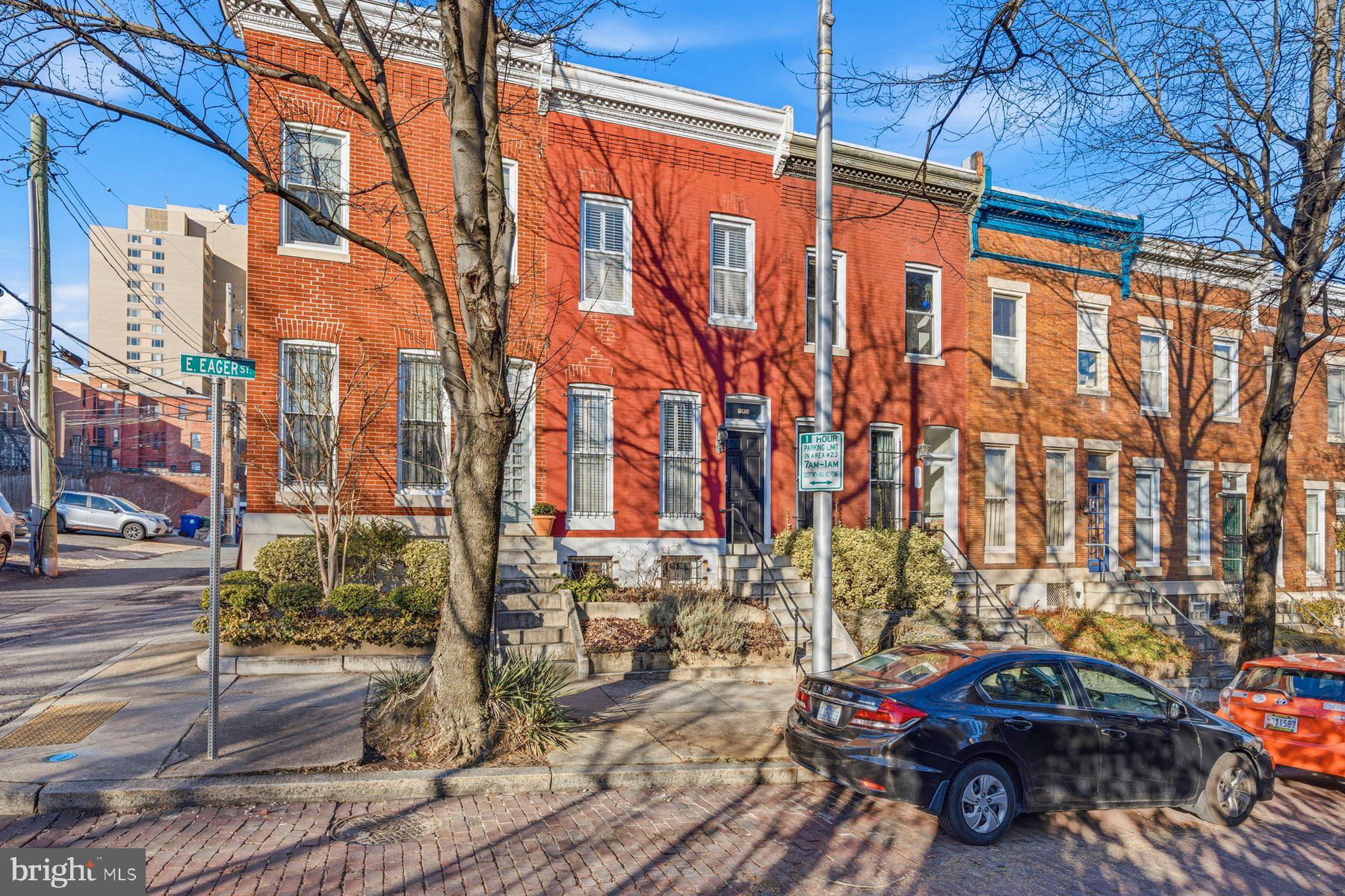 208 East Eager Street Baltimore, MD 21202 - Photo 1 of 31 a view of a car park in front of a building