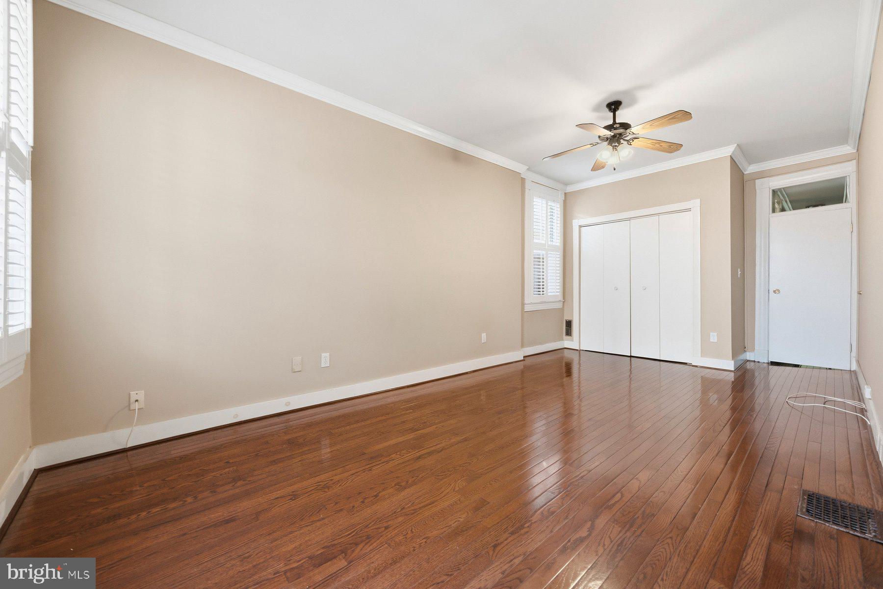 208 East Eager Street Baltimore, MD 21202 - Photo 20 of 31 a view of an empty room with wooden floor