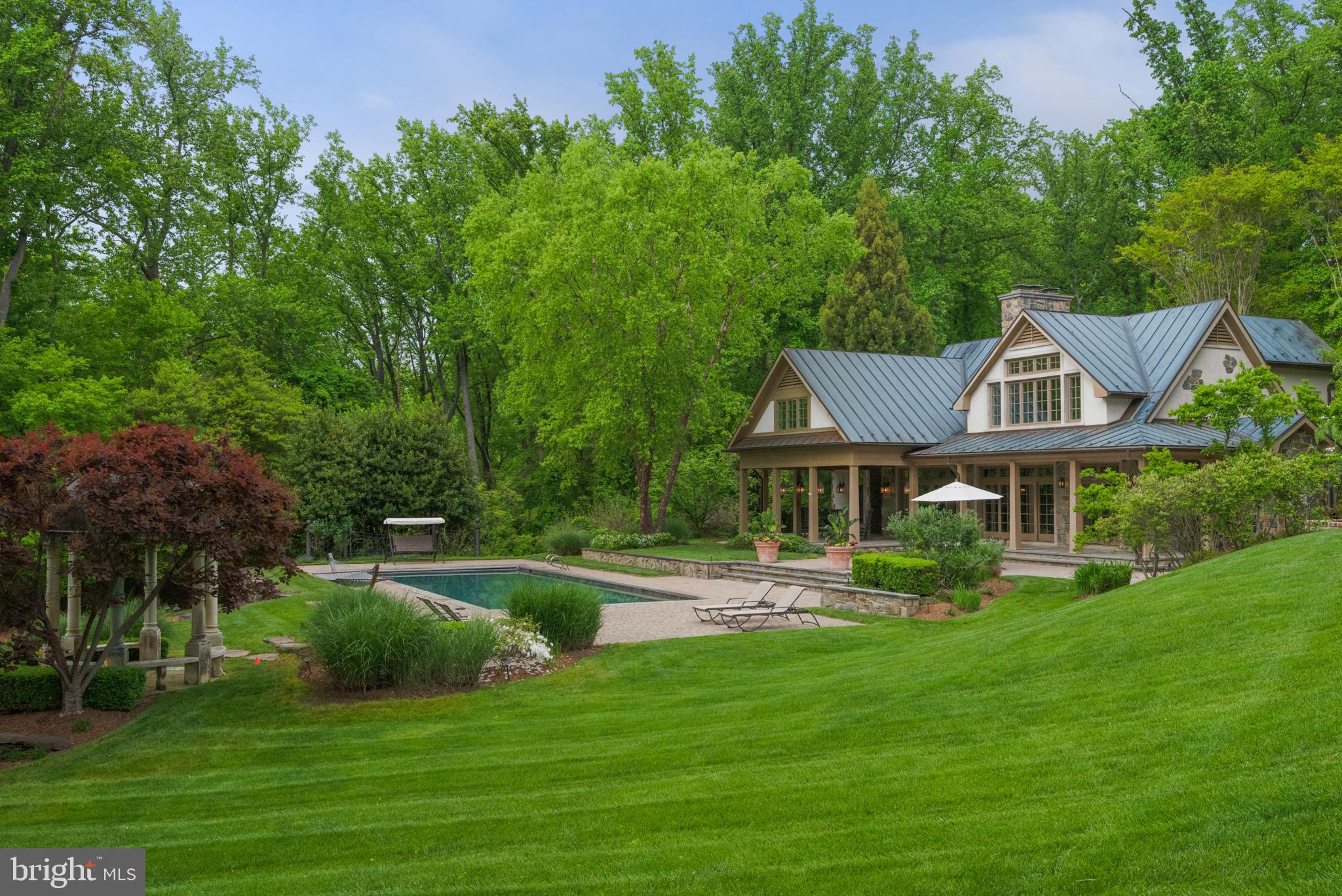 938 Old County Road Severna Park, MD 21146 - Photo 40 of 77 a front view of a house with a garden