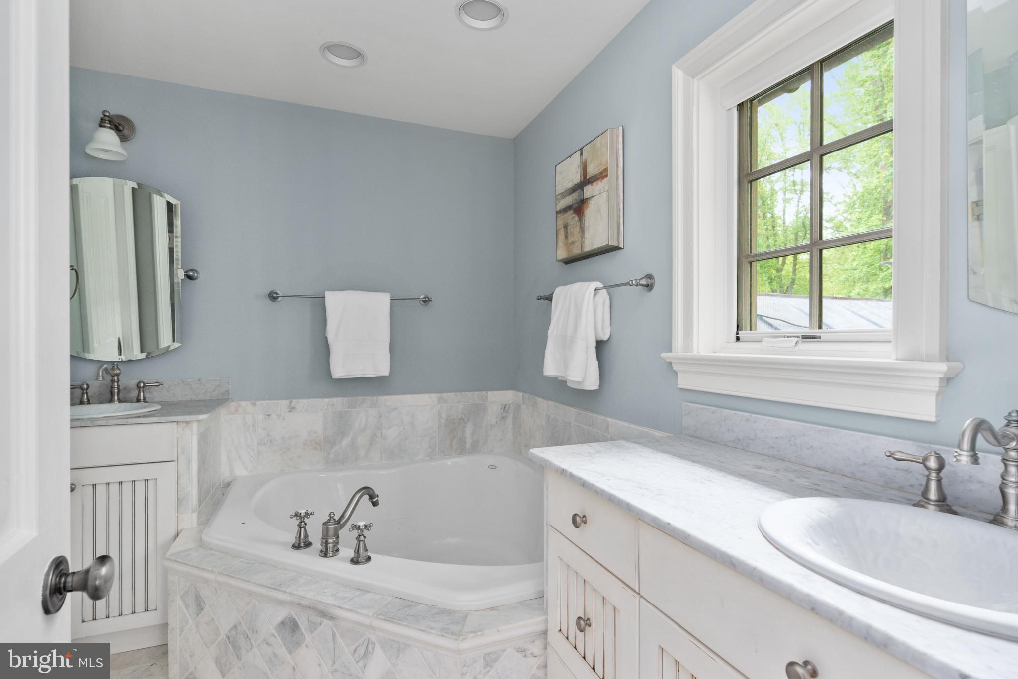 938 Old County Road Severna Park, MD 21146 - Photo 47 of 77 a bathroom with a tub sink and mirror