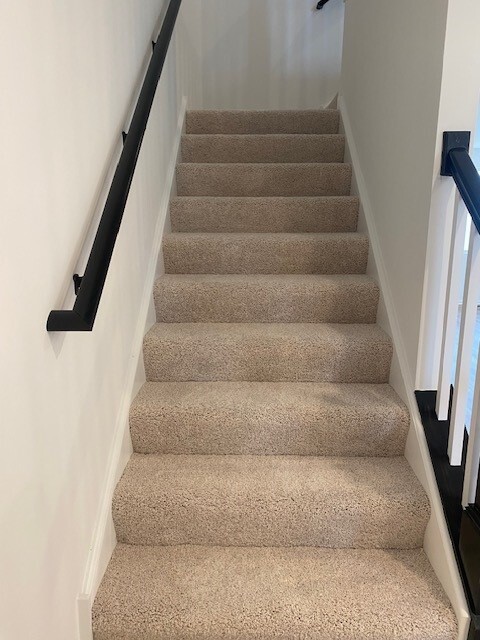 4515 Chelsea Mnr Circle, Unit 4515 Aurora, IL 60504 - Photo 23 of 37 a view of staircase with white walls