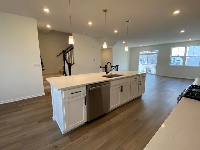 a view of a room with wooden floor and staircase
