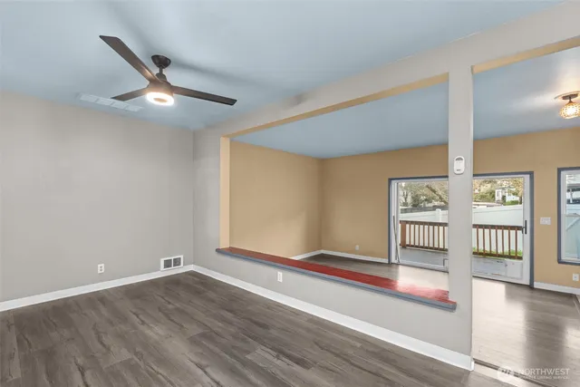 a view of livingroom with hardwood floor and ceiling fan