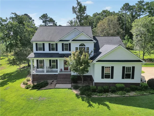 front view of a house with a yard