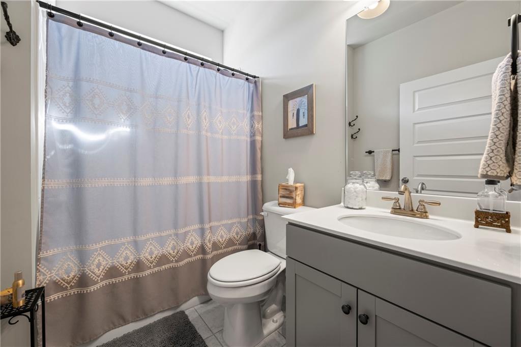 2347 Persimmon Chase Monroe, GA 30656 - Photo 15 of 85 a bathroom with a sink a toilet and shower