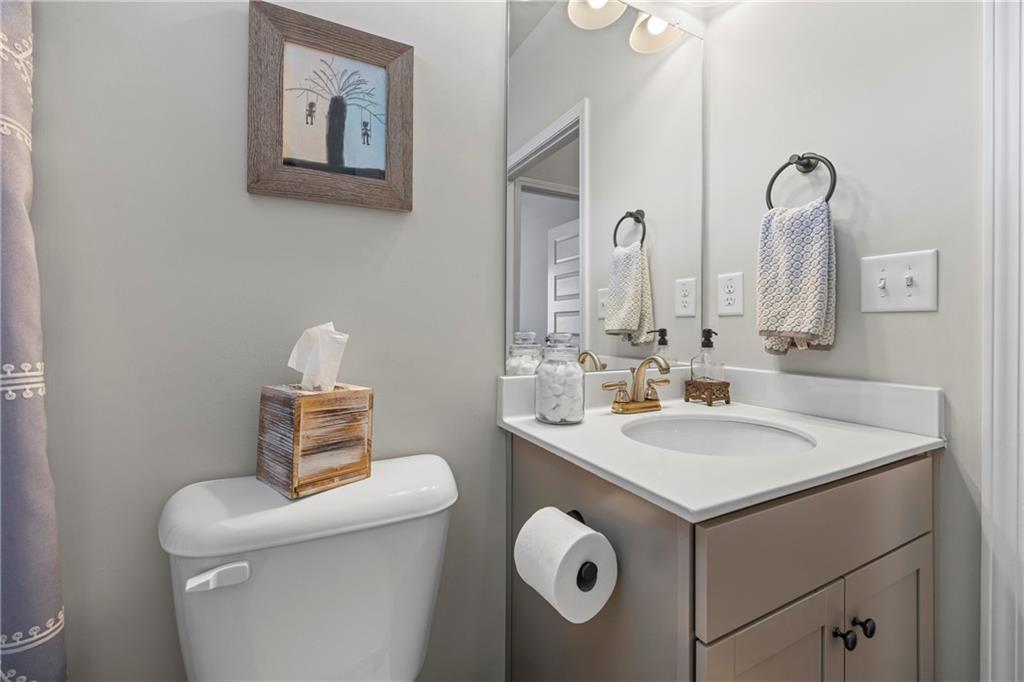 2347 Persimmon Chase Monroe, GA 30656 - Photo 16 of 85 a bathroom with a sink and a toilet