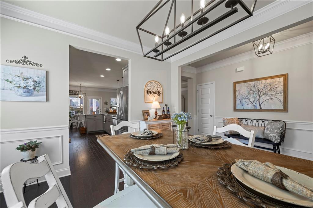 2347 Persimmon Chase Monroe, GA 30656 - Photo 29 of 85 a living room with furniture and a chandelier