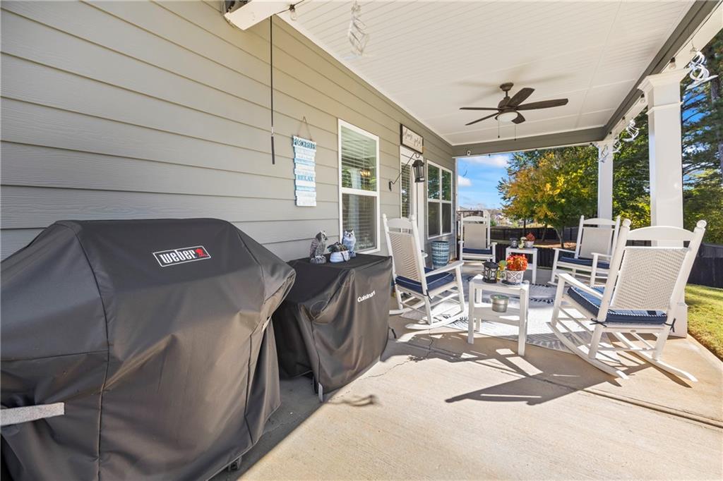 2347 Persimmon Chase Monroe, GA 30656 - Photo 50 of 85 a view of a patio with table and chairs