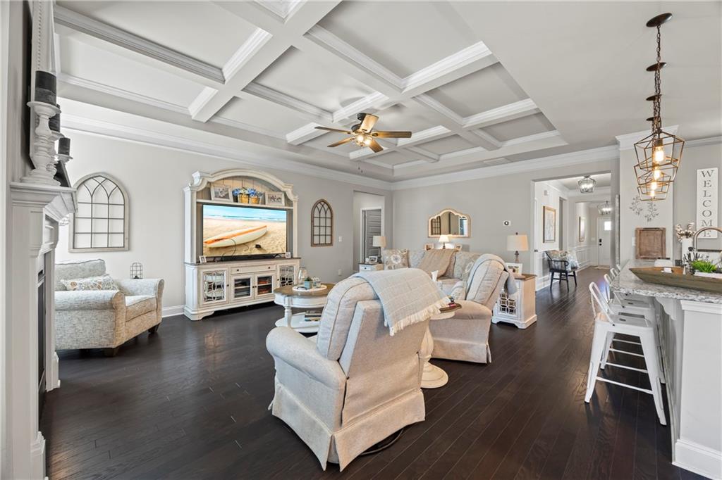 2347 Persimmon Chase Monroe, GA 30656 - Photo 53 of 85 a living room with furniture fireplace and a chandelier
