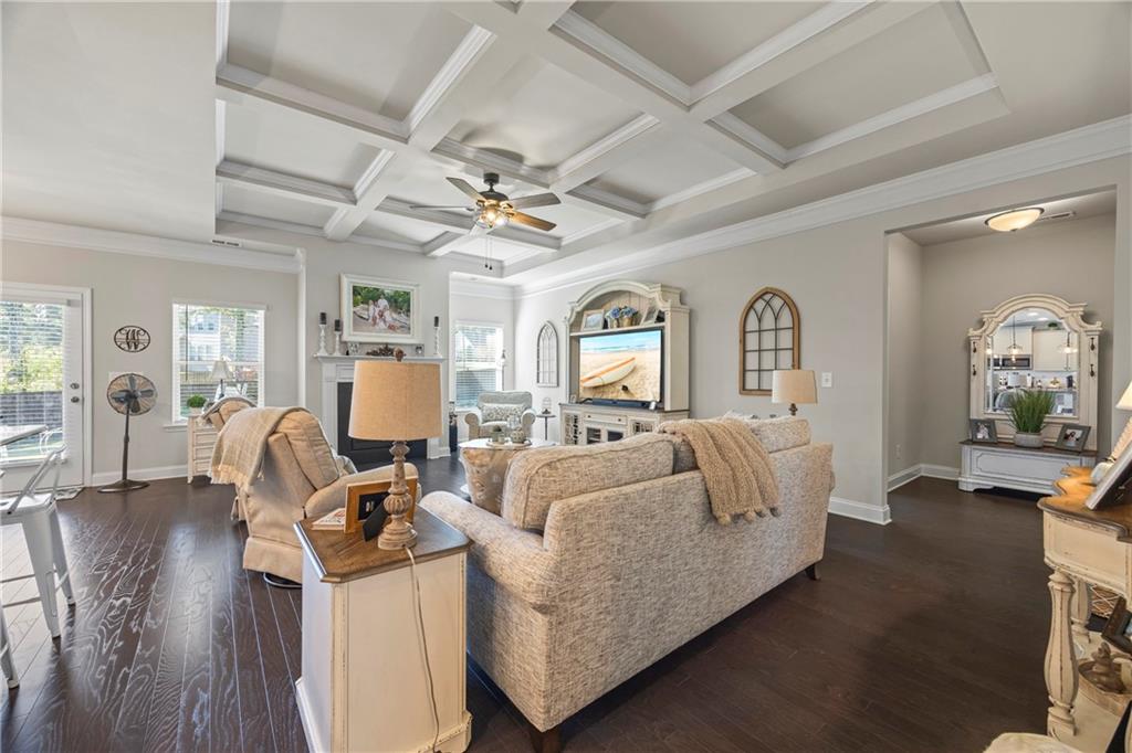 2347 Persimmon Chase Monroe, GA 30656 - Photo 56 of 85 a living room with furniture flat screen tv and wooden floor