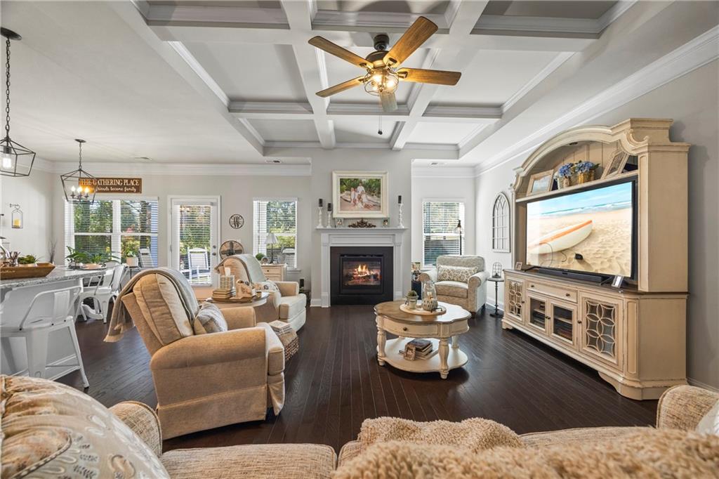 2347 Persimmon Chase Monroe, GA 30656 - Photo 57 of 85 a living room with furniture a flat screen tv and a fireplace