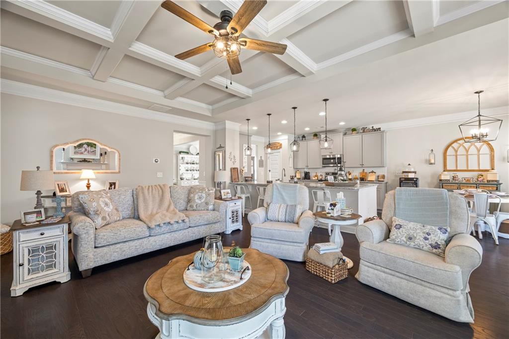 2347 Persimmon Chase Monroe, GA 30656 - Photo 60 of 85 a living room with furniture kitchen view and a chandelier