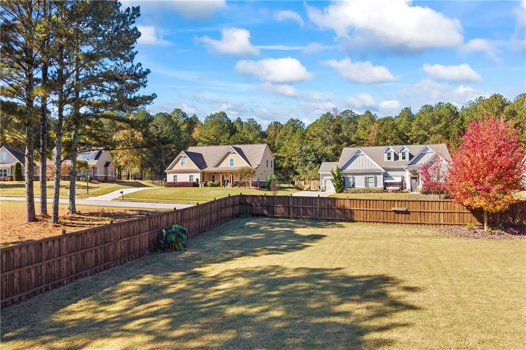 2347 Persimmon Chase Monroe, GA 30656 - Photo 7 of 85 a view of a swimming pool with an outdoor seating and a lots of trees