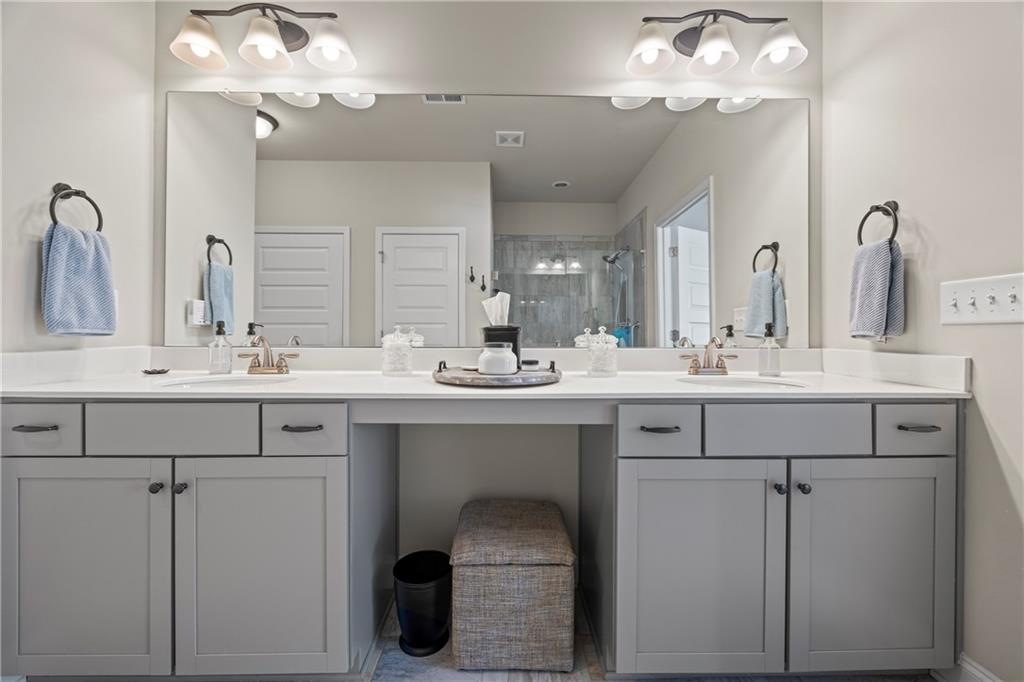 2347 Persimmon Chase Monroe, GA 30656 - Photo 72 of 85 a bathroom with a sink vanity and a mirror
