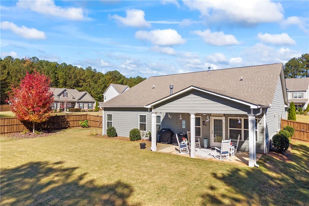 2347 Persimmon Chase Monroe, GA 30656 - Photo 9 of 85 a front view of a house with swimming pool and furniture