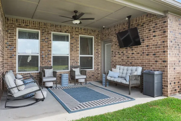 a balcony with furniture and a fireplace